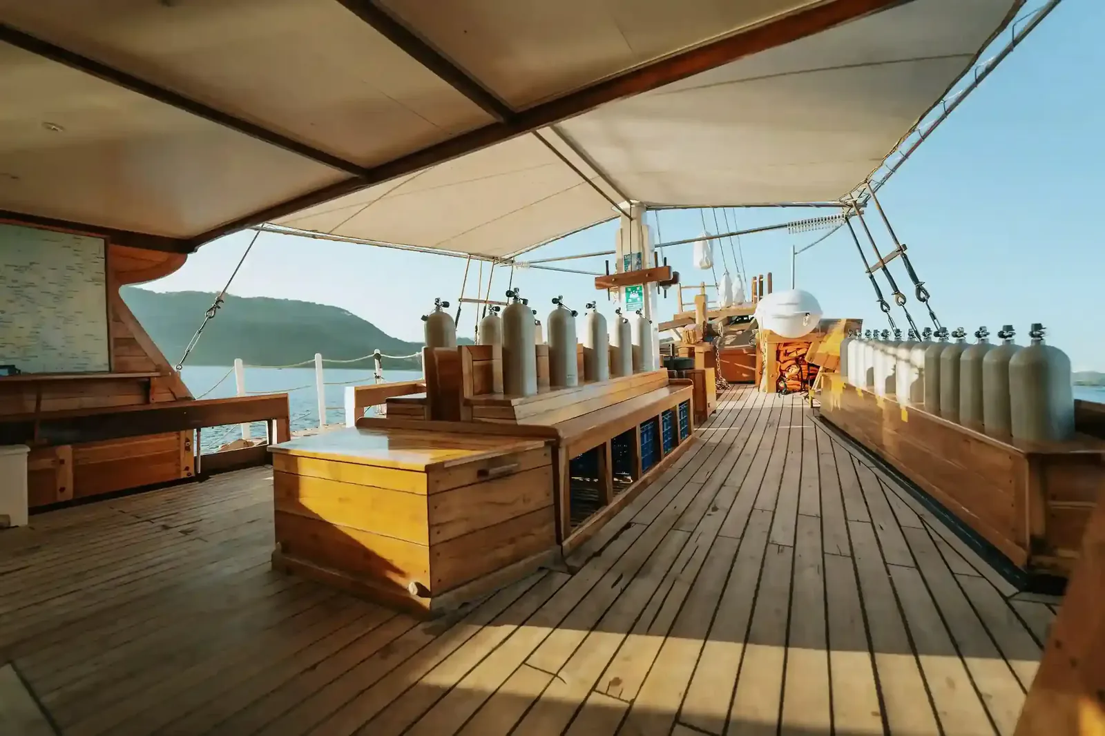 Dive deck with tanks and equipment on a Komodo liveaboard